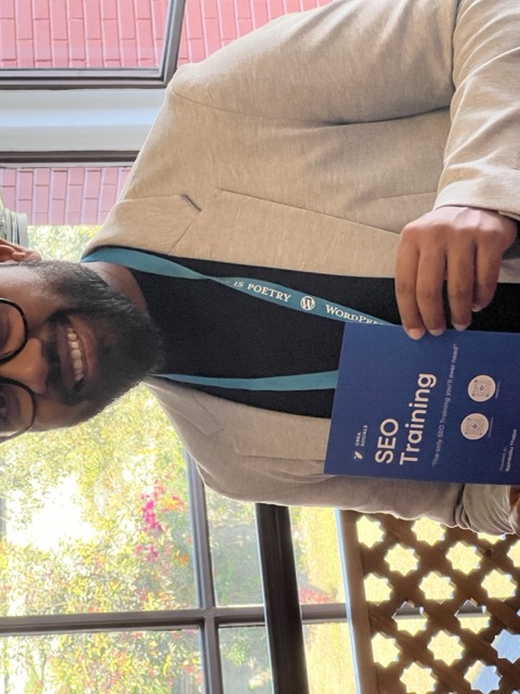 Rambabu Thapa with the SEO Training sponsor card at WordCamp Kathmandu.